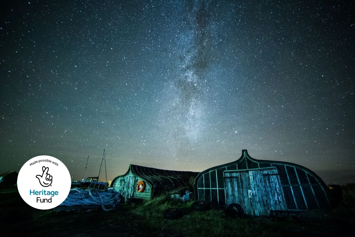 Milky Way above upturned boats on Holy Island