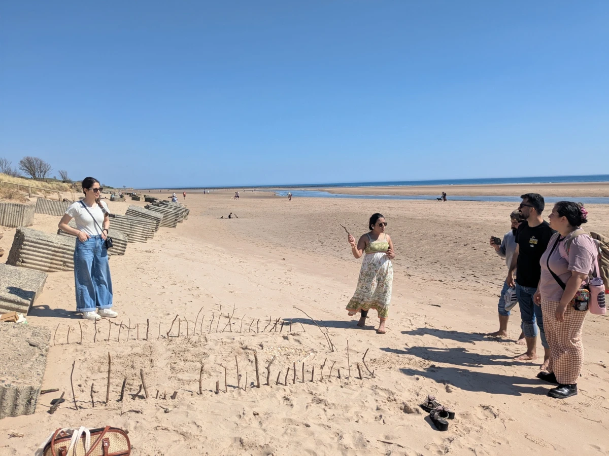 People drawing on the beach
