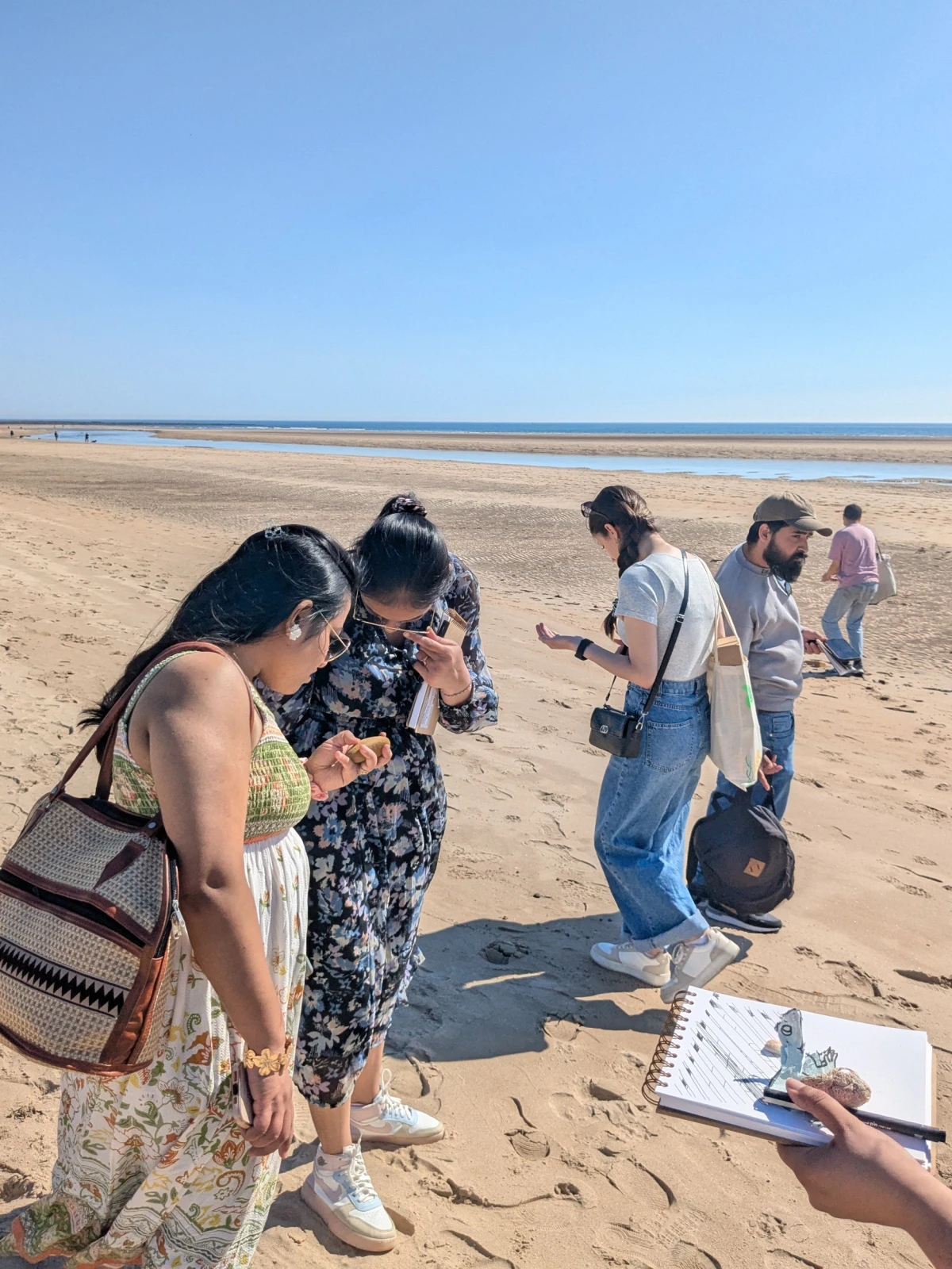 People making art on the beach