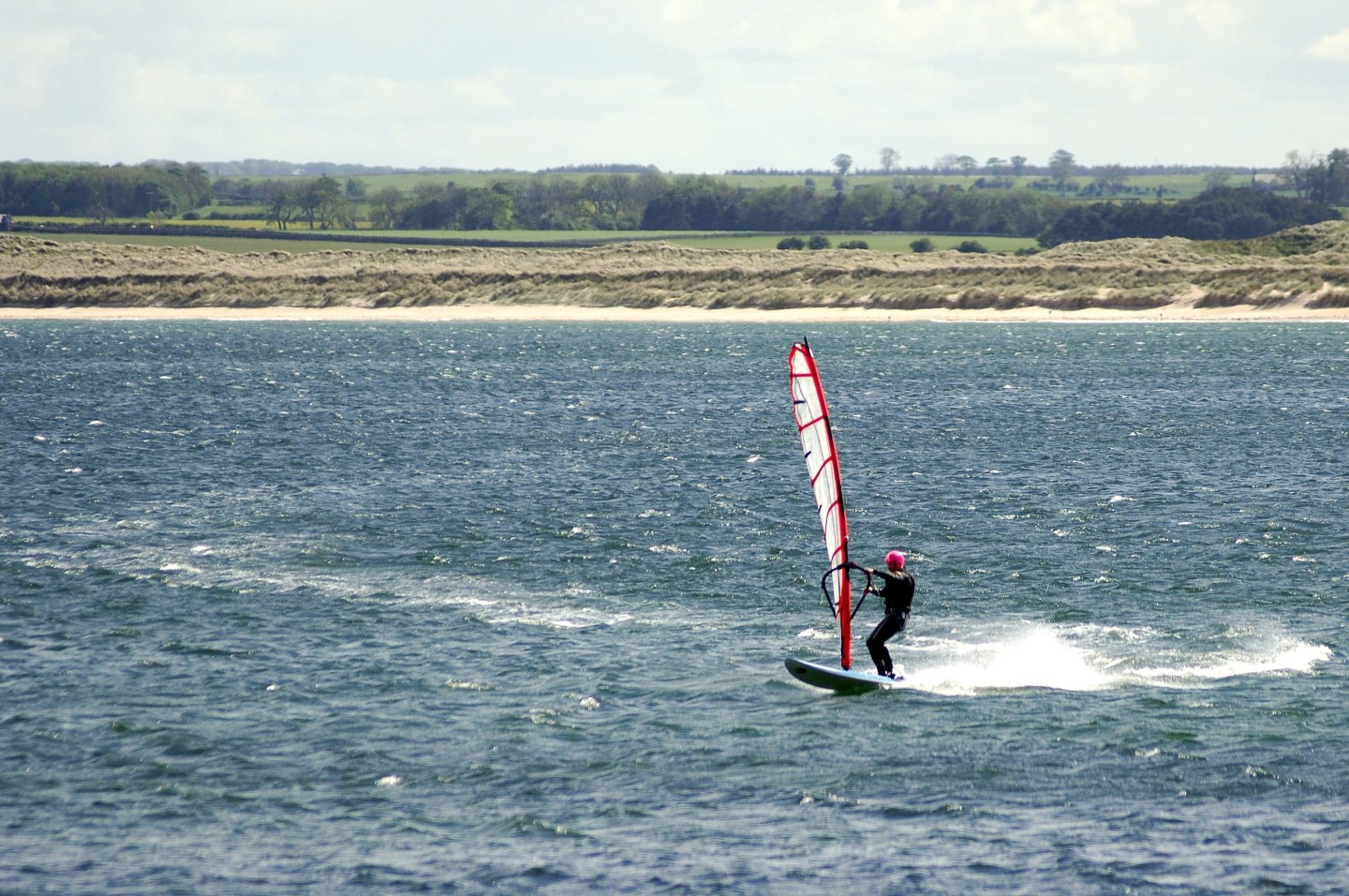 Windsurfer in the sea in Northumberland