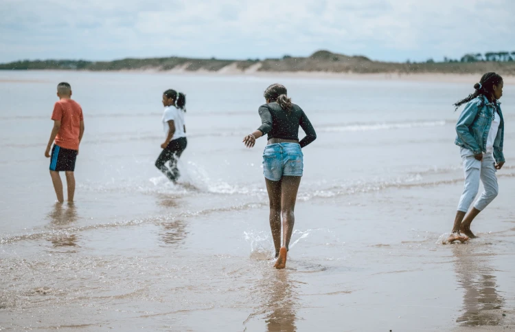 Young people playing in the sea