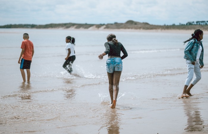 Young people playing in the sea